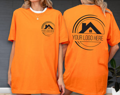 May include: Bright orange t-shirt with a white collar. The front features a black logo with a house silhouette and the text "YOUR LOGO HERE". The back of the shirt displays the same logo design. A casual, unisex tee.