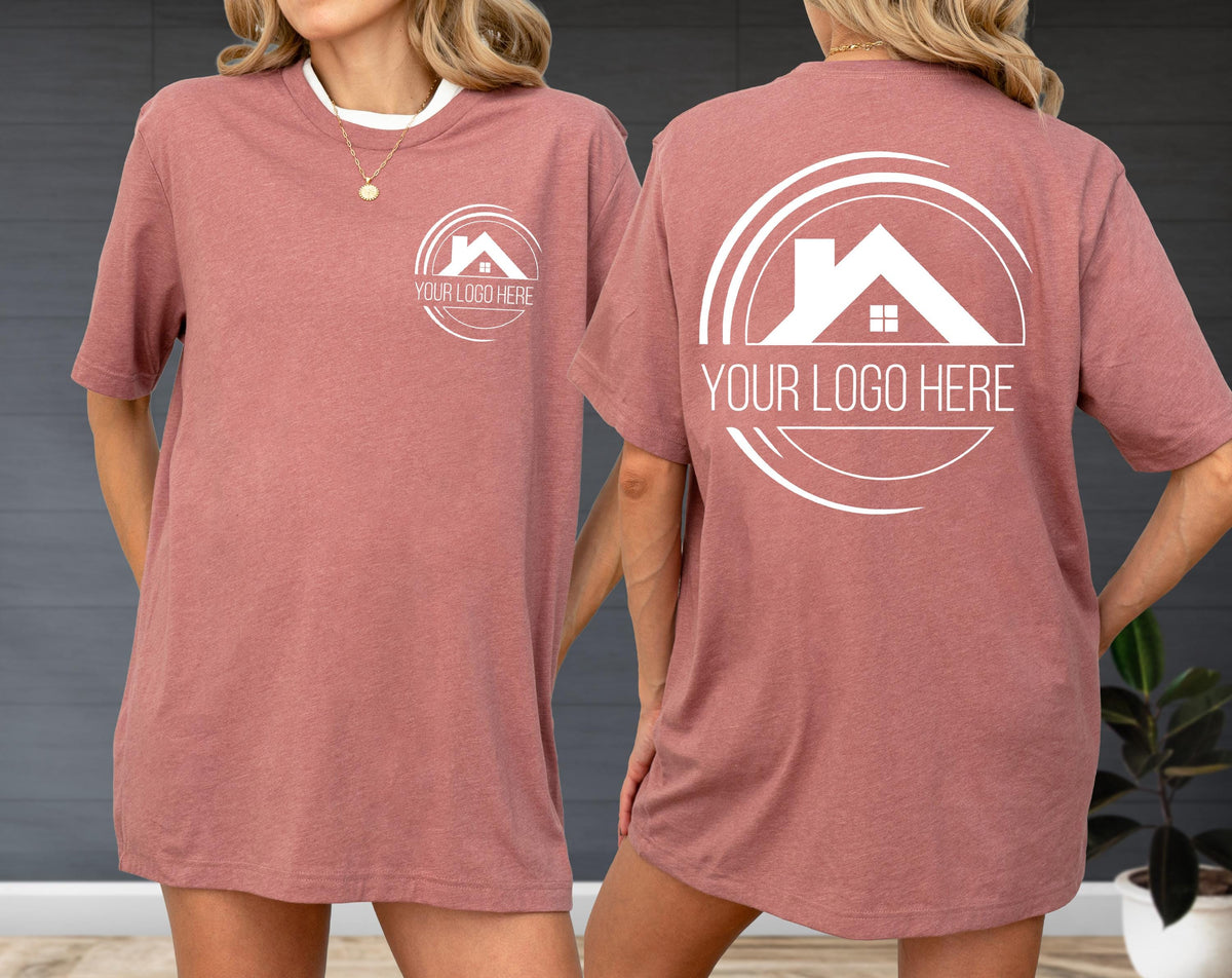 May include: A dusty rose t-shirt with a white collar. The front features a circular logo with a house silhouette and the text "YOUR LOGO HERE". The back of the shirt has a larger version of the same logo.