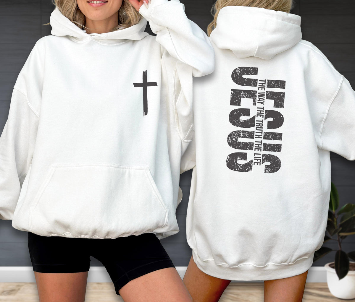 May include: White hoodie with a front pocket and a black cross on the front. The back of the hoodie features the word "JESUS" in large, distressed black letters, with the text "THE WAY THE TRUTH THE LIFE" below.