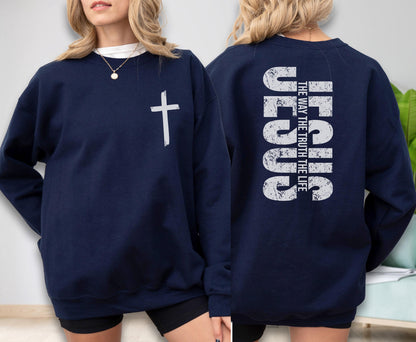 May include: Navy blue sweatshirt with a white cross on the front and the text "JESUS THE WAY THE TRUTH THE LIFE" on the back. The sweatshirt is a long-sleeved crew neck.