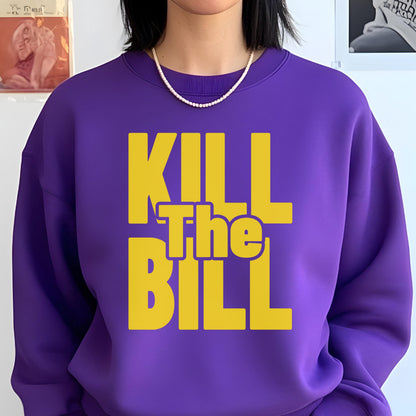 May include: A purple sweatshirt with the text "KILL The BILL" in yellow block letters. The sweatshirt has a crew neck and is worn with a white pearl necklace. The overall style is casual and bold, with a focus on the graphic text.
