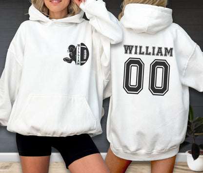 May include: A white hooded sweatshirt featuring a black graphic on the front left chest of a football player silhouette and a football with the name WILLIAM. The back displays the name WILLIAM in black letters above the large black number 00.
