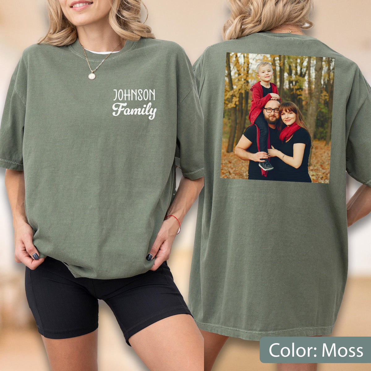 May include: Moss green t-shirt with "Johnson Family" printed on the front. The back of the shirt features a family photo. The shirt is a relaxed fit and has short sleeves. The color is described as "Moss".
