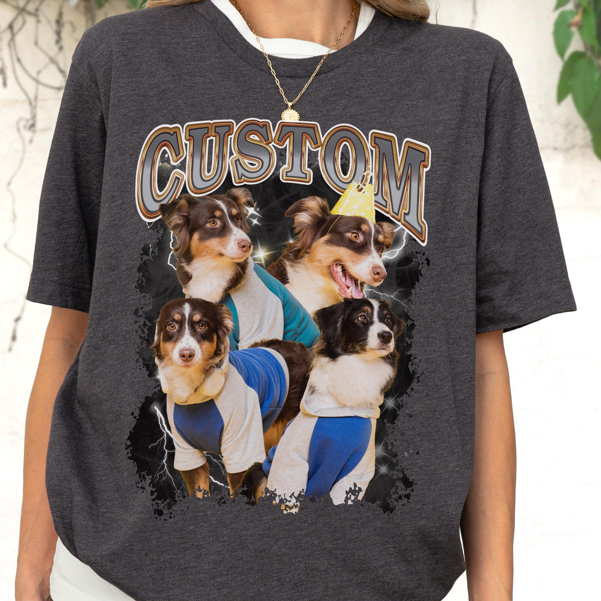 May include: Dark gray t-shirt featuring a graphic of four dogs with the word "CUSTOM" in a vintage style. The dogs are wearing blue and white shirts and a party hat. Lightning bolts and a black background complete the design.