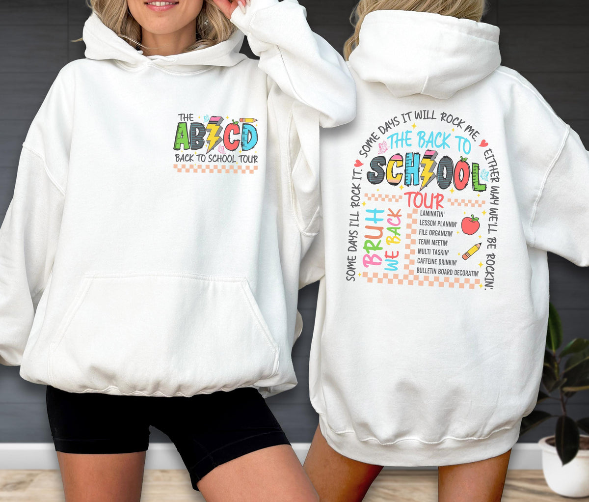 May include: White hoodie with a front pocket and a colorful graphic that says "THE ABCD BACK TO SCHOOL TOUR." The back of the hoodie has a school-themed design with text and images, including "THE BACK TO SCHOOL TOUR."
