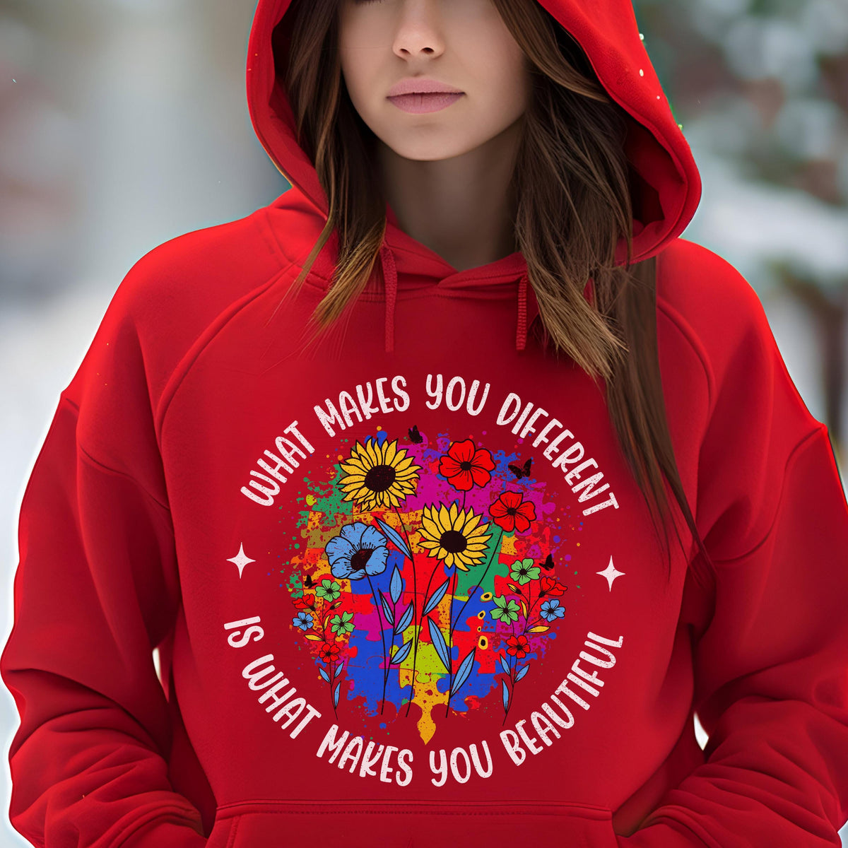 May include: A red hooded sweatshirt featuring a floral design with sunflowers, blue flowers, and red flowers. The text "WHAT MAKES YOU DIFFERENT IS WHAT MAKES YOU BEAUTIFUL" is printed in a circular pattern around the flowers.