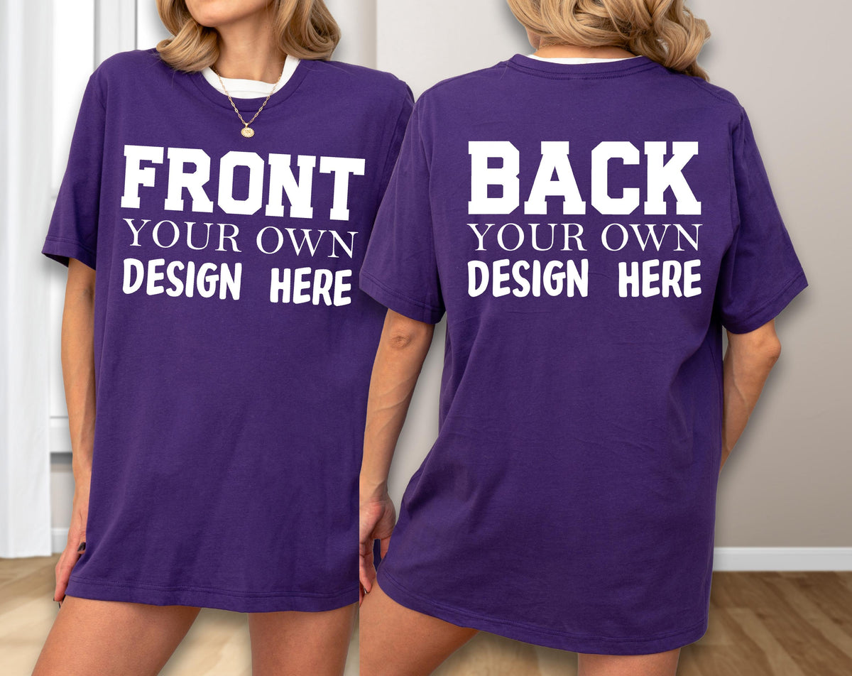 May include: A purple t-shirt with white text on the front that reads "FRONT YOUR OWN DESIGN HERE." The back of the shirt also has white text that reads "BACK YOUR OWN DESIGN HERE." The shirt has a white collar.