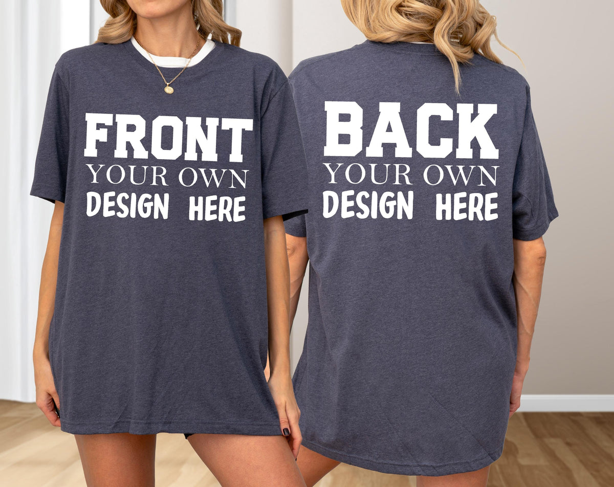 May include: A dark gray t-shirt with white text on the front that reads "FRONT YOUR OWN DESIGN HERE." The back of the shirt has the text "BACK YOUR OWN DESIGN HERE." The shirt has a white collar.