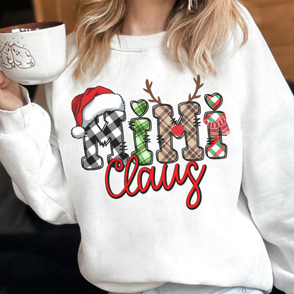 May include: White sweatshirt with the text "Mimi Claus" in a festive design. The letters are decorated with plaid patterns, a Santa hat, reindeer antlers, and hearts. A cozy holiday-themed apparel item.