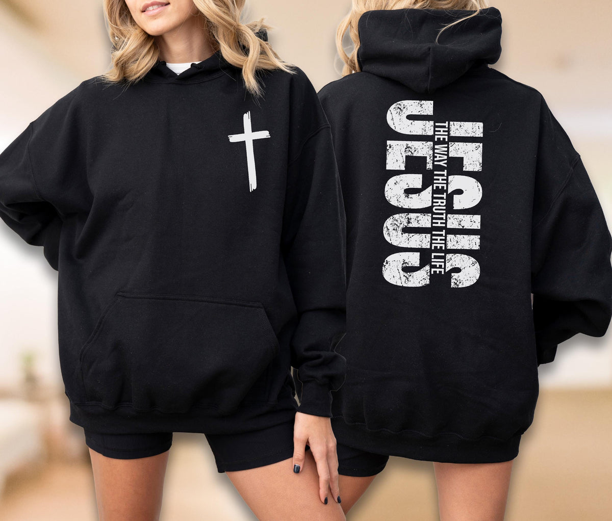 May include: Black hooded sweatshirt with a white cross on the front and the text "JESUS THE WAY THE TRUTH THE LIFE" on the back. The sweatshirt has a front pocket and a drawstring hood.