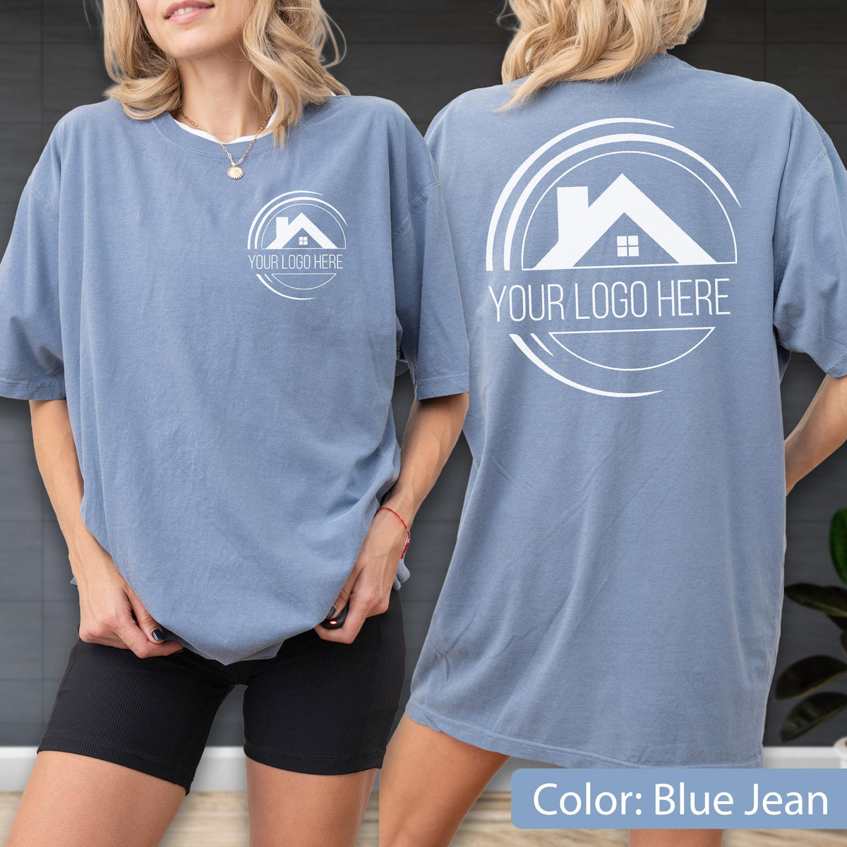 May include: Blue jean colored t-shirts with white logo and text "YOUR LOGO HERE" on the front and back. The t-shirts are short-sleeved and have a relaxed fit. The logo is a house silhouette inside a circular design.