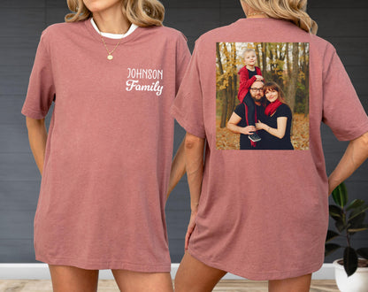 May include: A dusty rose t-shirt with a white collar and the text "JOHNSON Family" on the front. The back of the shirt features a family photo. The shirt is a casual, oversized fit.