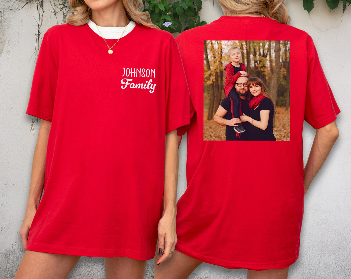 May include: Red t-shirt with a white collar and the text "JOHNSON Family" on the front. The back of the shirt features a family photo. The shirt is a solid red color.