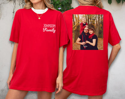 May include: Red t-shirt with a white collar and the text "JOHNSON Family" on the front. The back of the shirt features a family photo. The shirt is a solid red color.