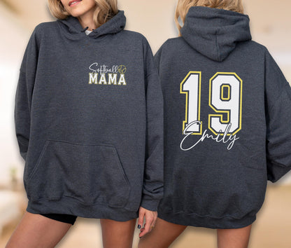 May include: Dark gray hoodie with a front pocket and hood. The front features the text "Softball MAMA" with a softball graphic. The back displays the number "19" in white with a yellow outline, and the name "Emily" in script.
