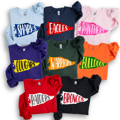 May include: A collection of long-sleeved sweatshirts in various colors, each featuring a team name in a pennant design. Colors include light blue, navy, pink, purple, green, orange, red, and black. The sweatshirts display the names "Sharks", "Eagles", "Panthers", "Cougars", "Warriors", "Bulldogs", "Raiders", and "Broncos".
