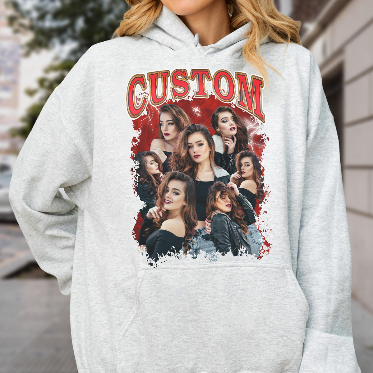 May include: A light gray hoodie featuring a graphic of multiple women with long brown hair. The graphic has a red background with the word "CUSTOM" in a red and gold font.