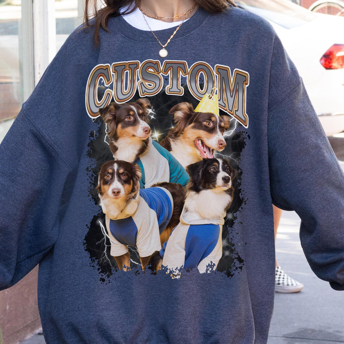 May include: Navy blue sweatshirt featuring a graphic of four dogs wearing shirts and a party hat. The word "CUSTOM" is printed across the top in a retro font. The dogs are various colors, including brown, black, and white.