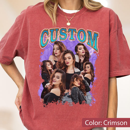 May include: Crimson-colored t-shirt featuring the word "CUSTOM" in a retro font with a blue outline. The shirt has a graphic of multiple women with long brown hair. The shirt is a comfortable, casual style.