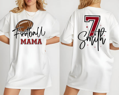 May include: A white t-shirt featuring a brown football graphic with the text Football MAMA on the front. The back displays the number 7 in dark red with a black outline above the name Smith in black script, accented by small red dots.