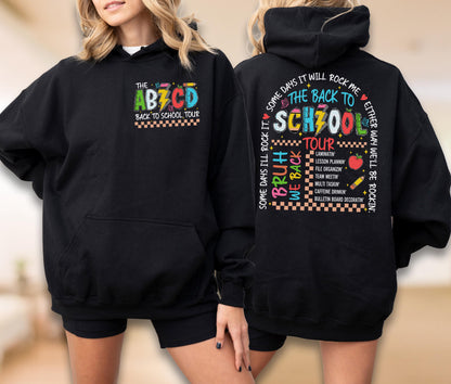 May include: Black hoodie with a front pocket and a colorful graphic that says "The ABZCD Back to School Tour". The back of the hoodie has a matching graphic with the text "The Back to School Tour" and other school-related phrases.