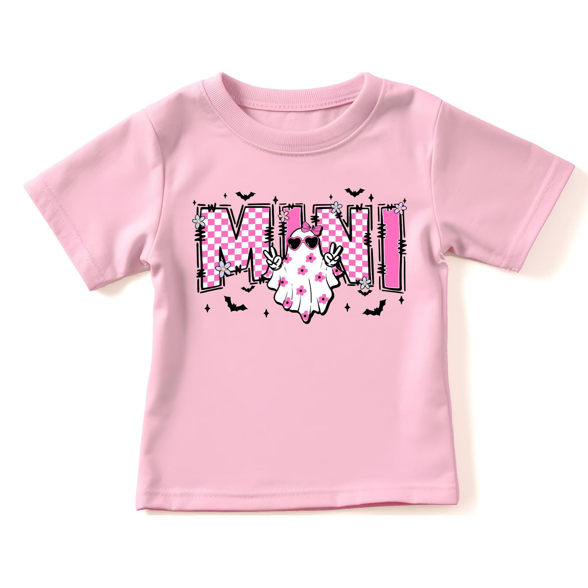 May include: A light pink short-sleeve t-shirt featuring a graphic print with the word MINI in a pink and white checkered pattern. A white ghost character with a pink bow and heart-shaped sunglasses makes a peace sign, surrounded by small flowers and bats.