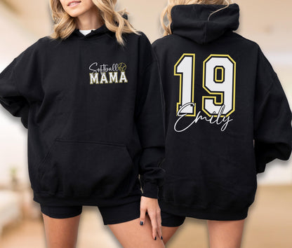 May include: Black hoodie with a front pocket and drawstring hood. The front features the text "Softball Mama" with a softball graphic. The back displays the number "19" with a yellow outline and the name "Emily" in a script font.