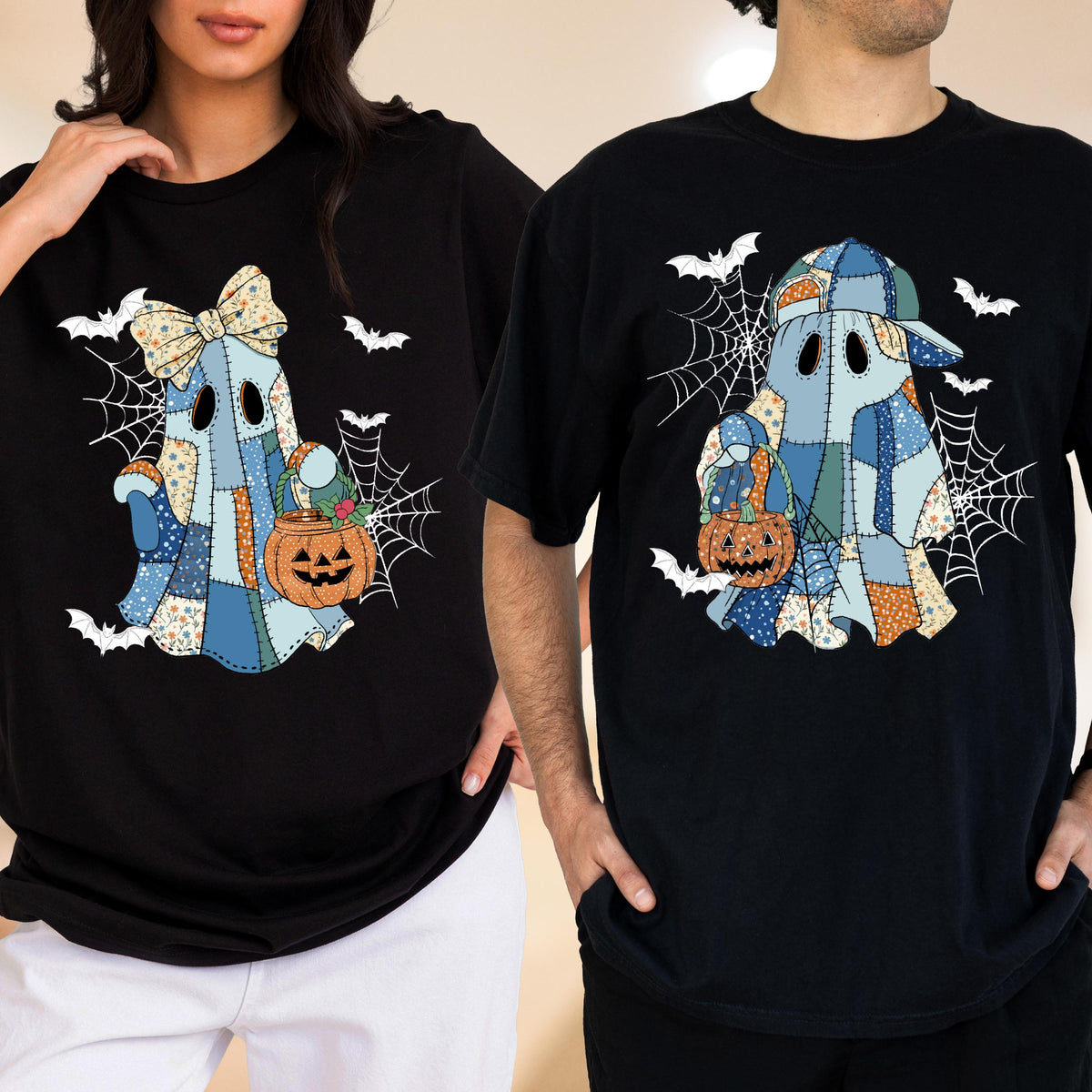 May include: Black t-shirts featuring a patchwork ghost design with a pumpkin bucket, spiderwebs, and bats. The ghost wears a bow and a cap. Halloween-themed apparel.