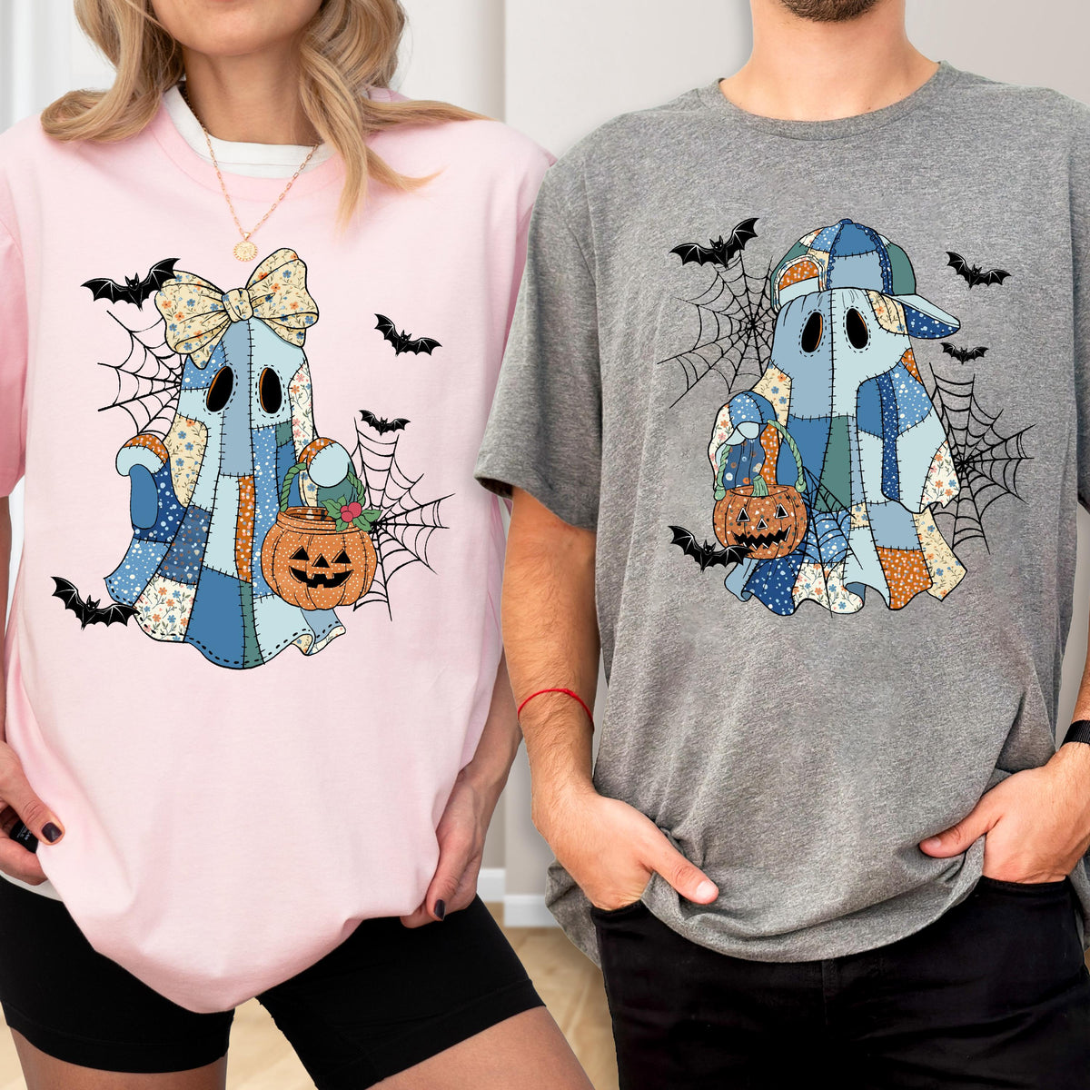 May include: Pink and gray t-shirts featuring a patchwork ghost design with a pumpkin and spiderwebs. The ghost wears a bow and a baseball cap. Black bats are scattered around the design, perfect for Halloween.
