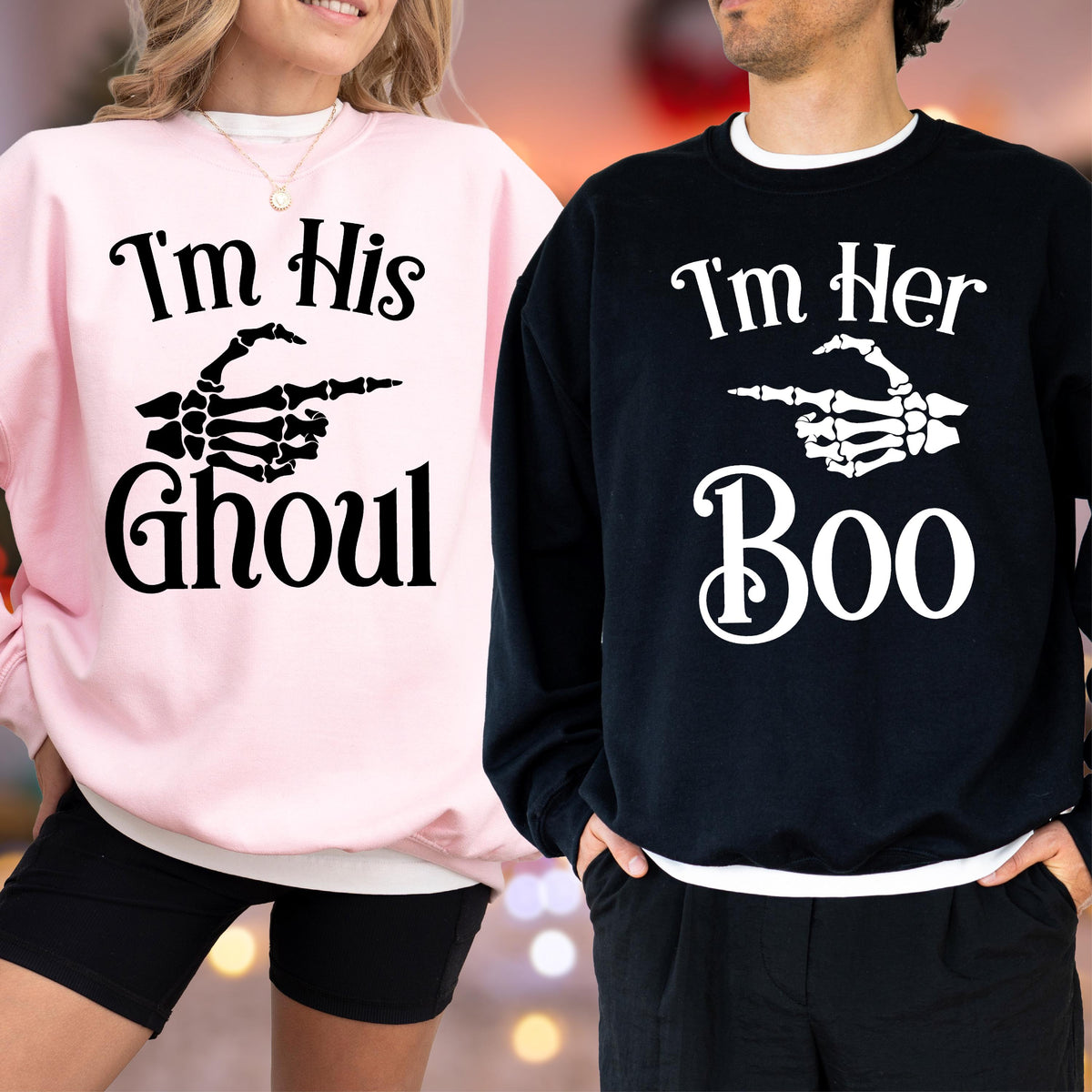 May include: Matching Halloween sweatshirts. One is light pink with the text "I'm His Ghoul" and a skeleton hand pointing to the right. The other is black with "I'm Her Boo" and a skeleton hand pointing to the left. Both have white trim.