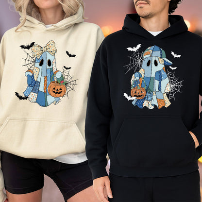 May include: A cream-colored hoodie and a black hoodie, each featuring a graphic of a ghost made of blue and orange patchwork fabric. The ghosts are surrounded by spiderwebs and bats, and each holds an orange jack-o'-lantern candy bucket.