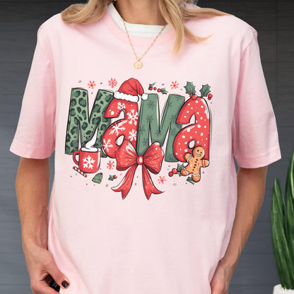 May include: Pink t-shirt with the word "MAMA" in a Christmas-themed design. The "M" is green with a leopard print, the "A"s are red with white polka dots, and the design includes a Santa hat, snowflakes, and a gingerbread man.