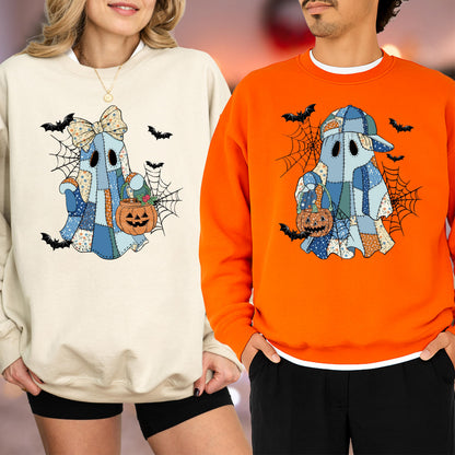 May include: Two crewneck sweatshirts, one cream and one orange, each featuring a graphic of a blue patchwork ghost. The ghost on the cream sweatshirt wears a bow, while the ghost on the orange sweatshirt wears a baseball cap. Both hold orange pumpkin buckets amidst black spiderwebs and flying bats.