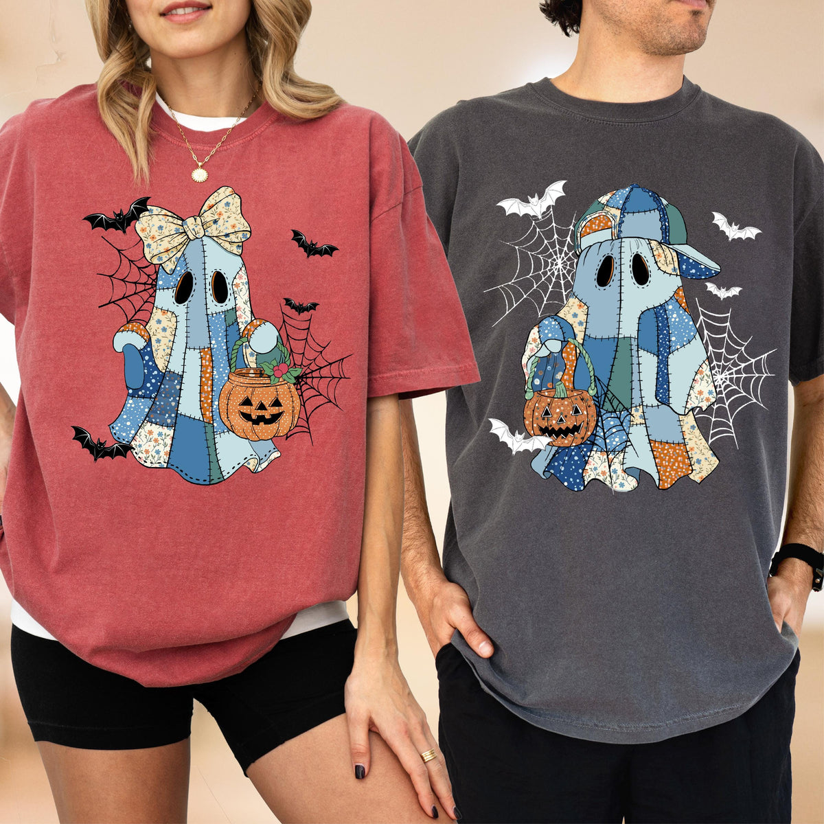 May include: A red t-shirt and a dark gray t-shirt, each featuring a graphic of a ghost made of blue patchwork fabric. The ghosts hold orange jack-o'-lantern buckets and are surrounded by black spiderwebs and flying bats.