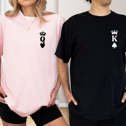 May include: A light pink crew neck sweatshirt with a black Queen of Hearts graphic and a black t-shirt with a King of Spades graphic. The graphics include a crown, the letter Q or K, and a heart or spade symbol.