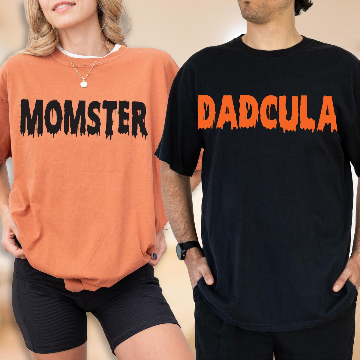 May include: An orange t-shirt with the black text MOMSTER in a dripping font and a black t-shirt with the orange text DADCULA in a dripping font. Both shirts feature short sleeves and a crew neckline, showcasing a Halloween-themed graphic design.