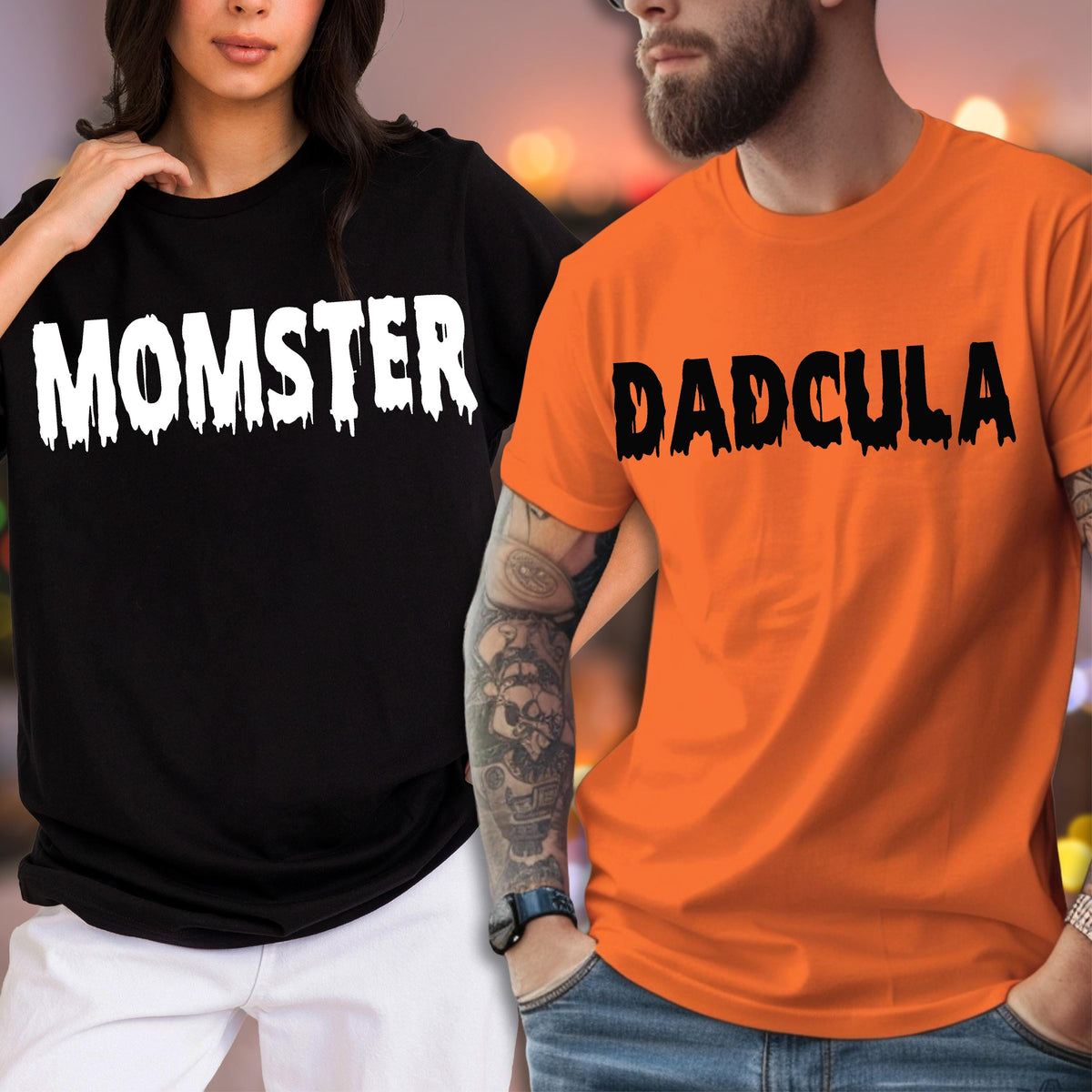 May include: A black t-shirt with the white text MOMSTER in a dripping font and an orange t-shirt with the black text DADCULA in a dripping font. Both shirts feature short sleeves and a crew neckline, displaying a graphic design style.