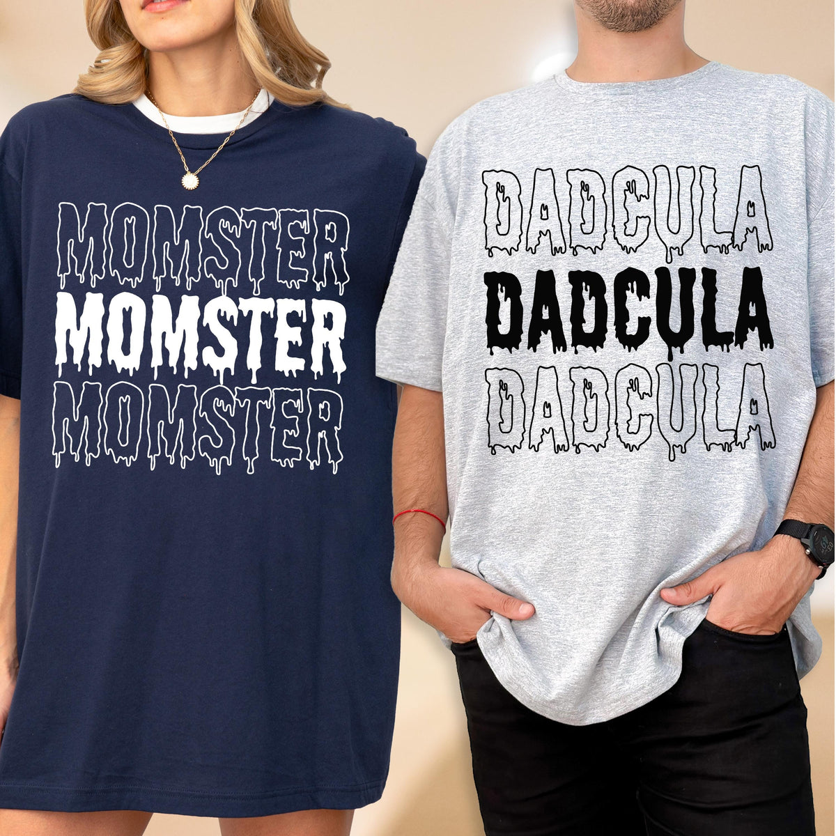 May include: Two short-sleeved t-shirts. One is navy blue with the word "MOMSTER" in white, repeated three times. The other is light gray with the word "DADCULA" in black, repeated three times. Both shirts have a dripping effect on the text.