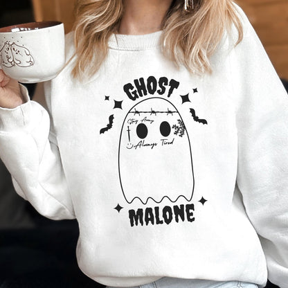 May include: White sweatshirt featuring a ghost design with the text "GHOST MALONE." The ghost has two black eyes, a smile, and the words "Stay Away" and "Always Tired." The design includes bats and stars.