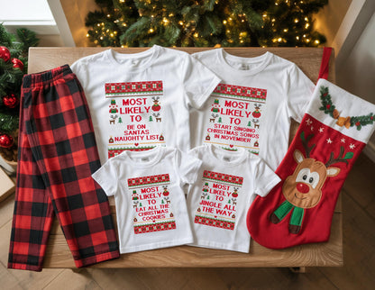 May include: A collection of Christmas-themed apparel, including white t-shirts with festive text and a red and black plaid pajama set. The shirts feature phrases like "Most Likely to be on Santa's Naughty List" and "Most Likely to Start Singing Christmas Songs". A red Christmas stocking is also included.