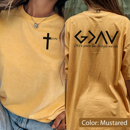 May include: A mustard yellow t-shirt featuring a black cross graphic with the text G>AV on the front left chest. The back of the shirt displays the large black text G>AV with the phrase God is greater than the highs and lows below it.