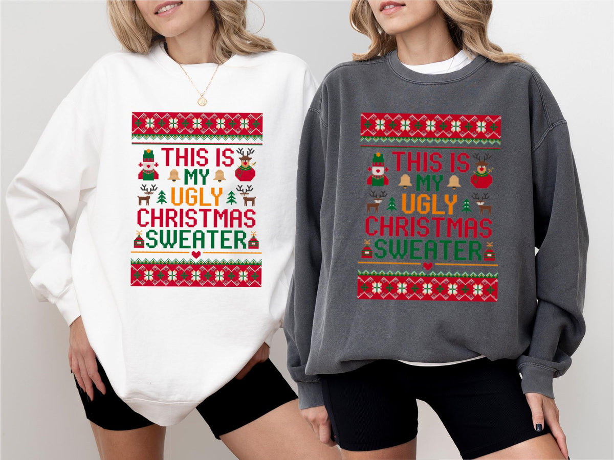 May include: Two sweatshirts, one white and one gray, each with a festive design. The design includes the text "THIS IS MY UGLY CHRISTMAS SWEATER" in a colorful, patterned layout with holiday icons like a snowman, reindeer, and bells. The sweatshirts are casual wear.