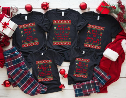 May include: Black t-shirts with festive holiday phrases in red and green, including "Most Likely To" and other Christmas-themed text. The shirts are paired with plaid pajama pants and Christmas decorations.