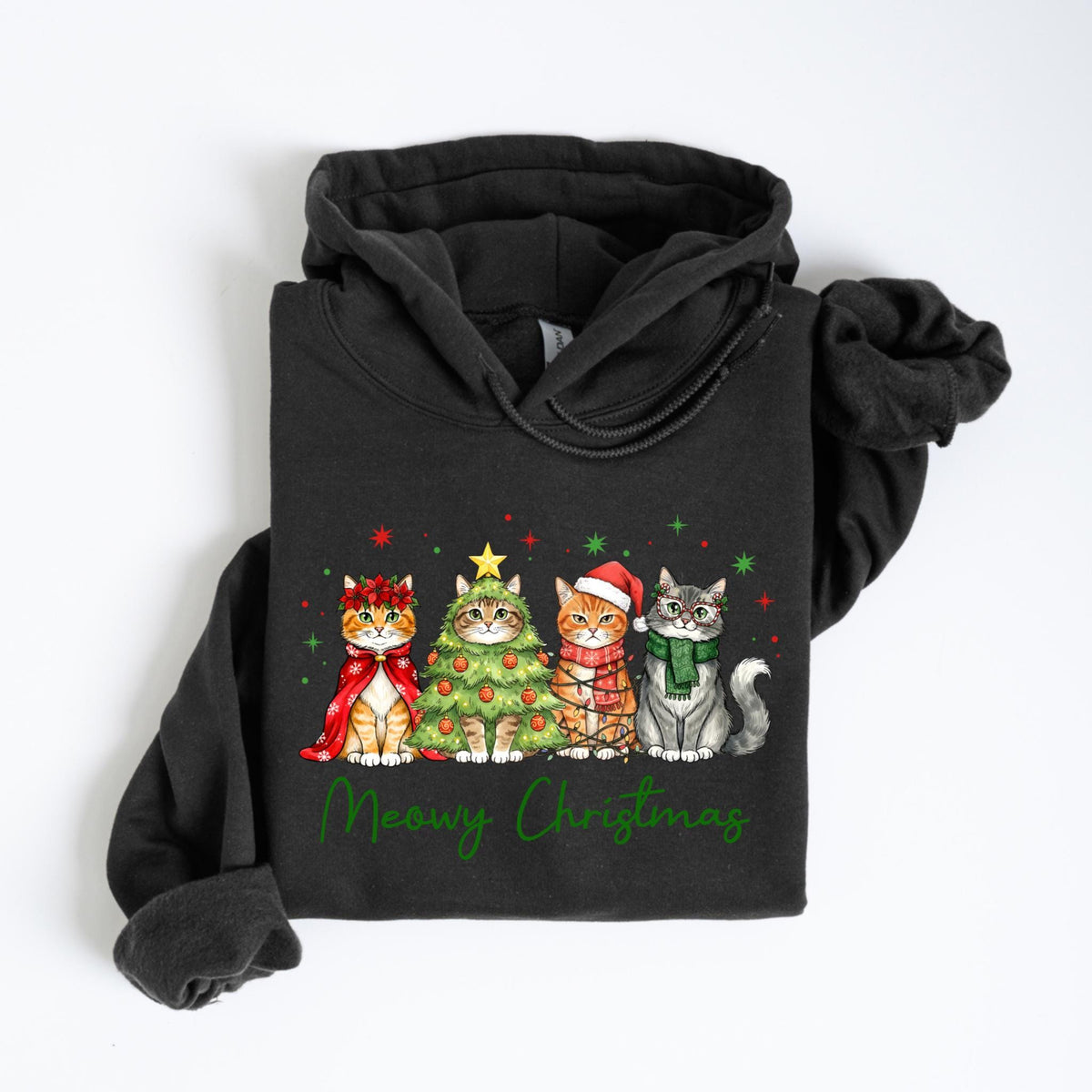 May include: A dark gray hooded sweatshirt featuring a festive graphic of four cats dressed for Christmas. The cats are adorned with holiday accessories, including a wreath, a Christmas tree, a Santa hat, and a scarf. The words "Meowy Christmas" are written in green script below the cats.