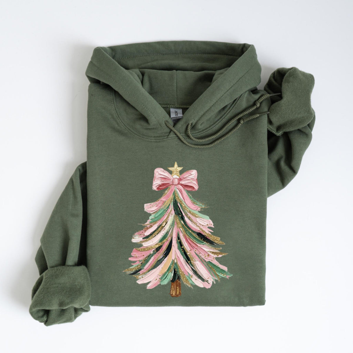 May include: Olive green hoodie featuring a Christmas tree design. The tree is decorated with pink, green, and gold brushstrokes, topped with a pink bow and a gold star. The hoodie has a drawstring hood and long sleeves.