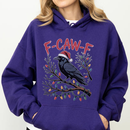 May include: A deep purple hooded sweatshirt featuring a graphic of a black raven wearing a red and white Santa hat, perched on a brown branch wrapped in colorful Christmas lights, with the red text F-CAW-F printed above the bird.