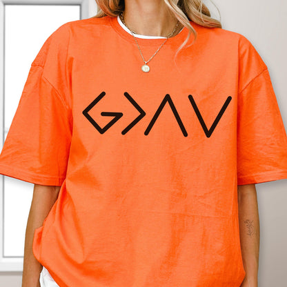 May include: A bright orange short-sleeved t-shirt featuring a black graphic print on the chest. The design consists of the mathematical symbols G > A V, which are arranged horizontally in a clean, sans-serif font across the front of the shirt.