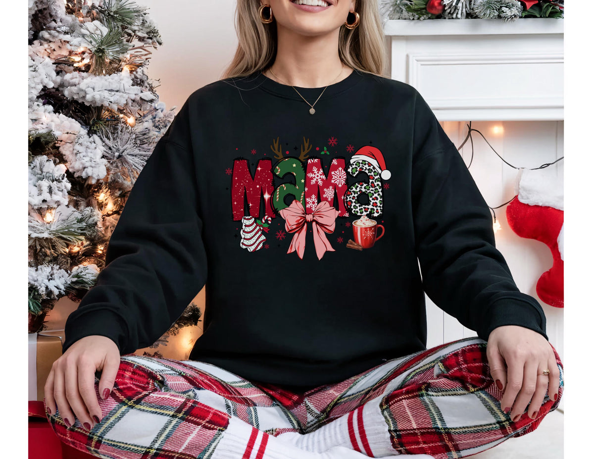 May include: Black sweatshirt with the word "Mama" in a festive Christmas design. The letters are decorated with holiday elements like antlers, a Santa hat, and a bow. A mug of hot cocoa is also featured.
