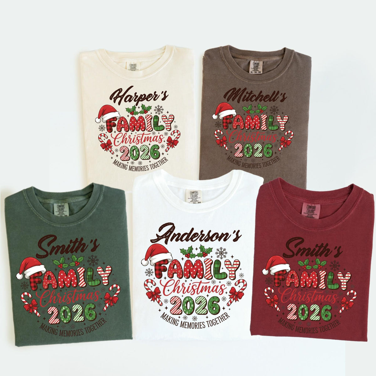 May include: Five t-shirts in various colors, each featuring a Christmas design. The design includes the text "Family Christmas 2026" with a Santa hat, candy canes, and the phrase "Making Memories Together."