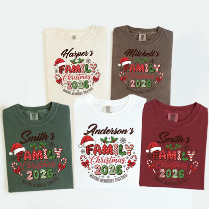 May include: Five t-shirts in various colors, each featuring a Christmas design. The design includes the text "Family Christmas 2026" with a Santa hat, candy canes, and the phrase "Making Memories Together."